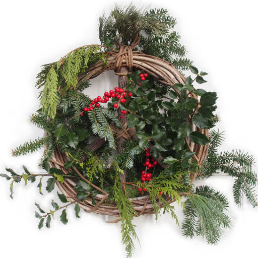Woven cane shaped like a peace sign decorated with pine boughs, holly branches, and red berries with the word Peace written below in a round-hand casual font